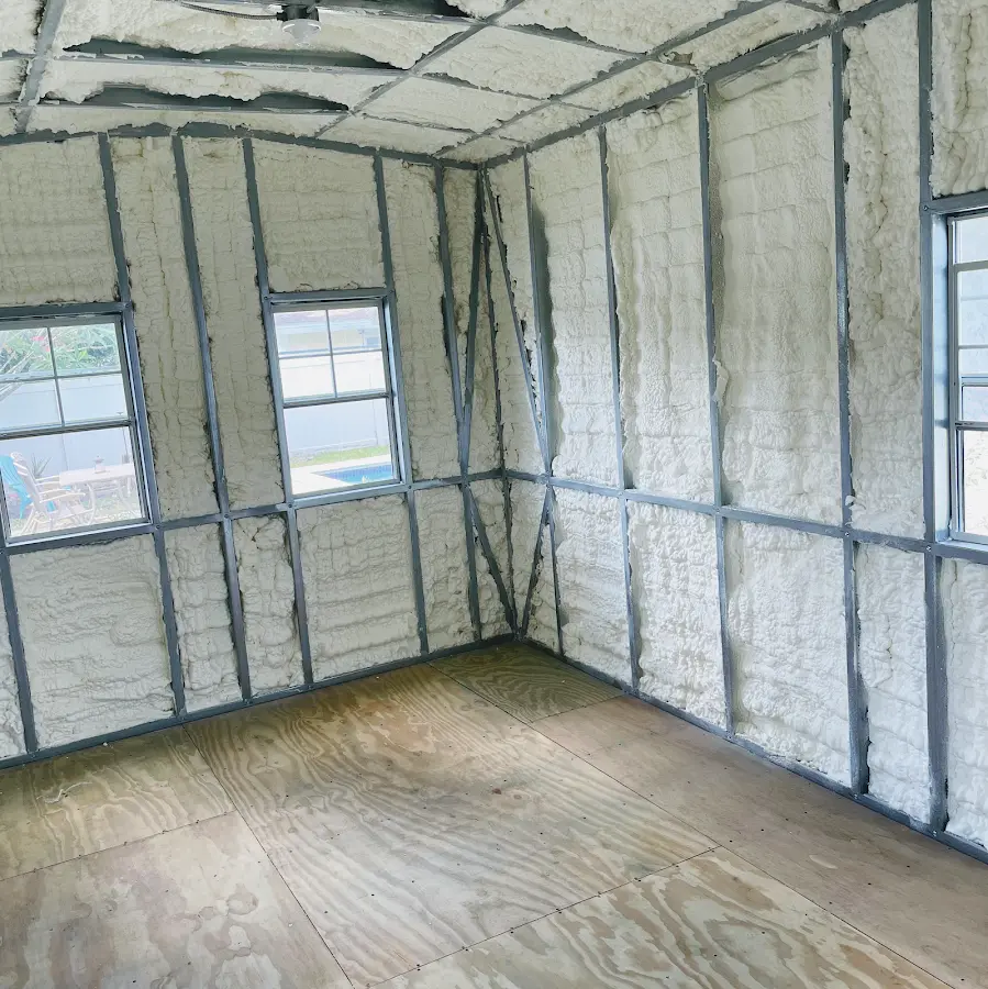 Closed-cell spray foam insulation applied to wall cavities in a residential project in Carrollton